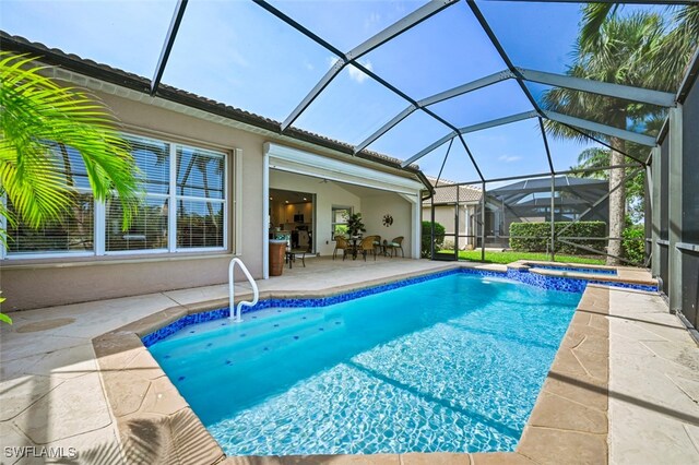 10016 Majestic Ave, Fort Myers, FL 33913 - view of pool with a patio area, a pool with connected hot tub, and a lanai
