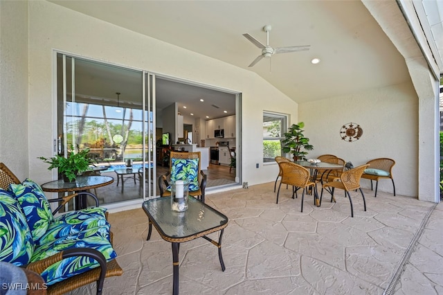 10016 Majestic Ave, Fort Myers, FL 33913 - living room featuring healthy amount of natural light, lofted ceiling, ceiling fan, recessed lighting, and light stone finish floors
