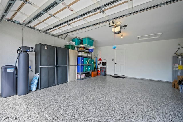 10016 Majestic Ave, Fort Myers, FL 33913 - garage with water heater and a garage door opener