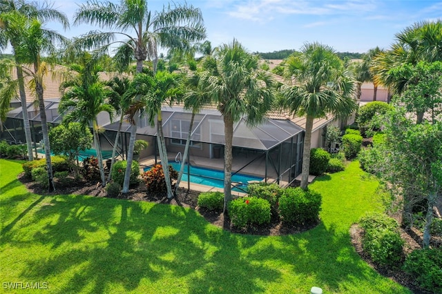 10016 Majestic Ave, Fort Myers, FL 33913 - rear view of property with a yard, an outdoor pool, stucco siding, and a lanai