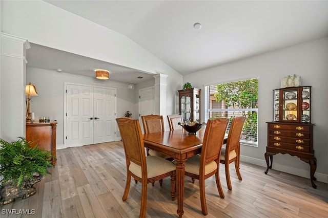 10016 Majestic Ave, Fort Myers, FL 33913 - dining space featuring decorative columns, vaulted ceiling, light wood-style flooring, and baseboards
