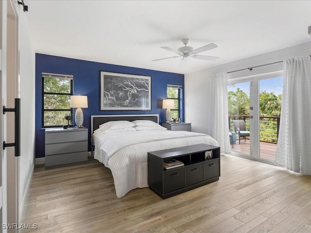 20697 Charing Cross Cir, Estero, FL 33928 - bedroom with access to outside, multiple windows, light wood-style floors, and a ceiling fan