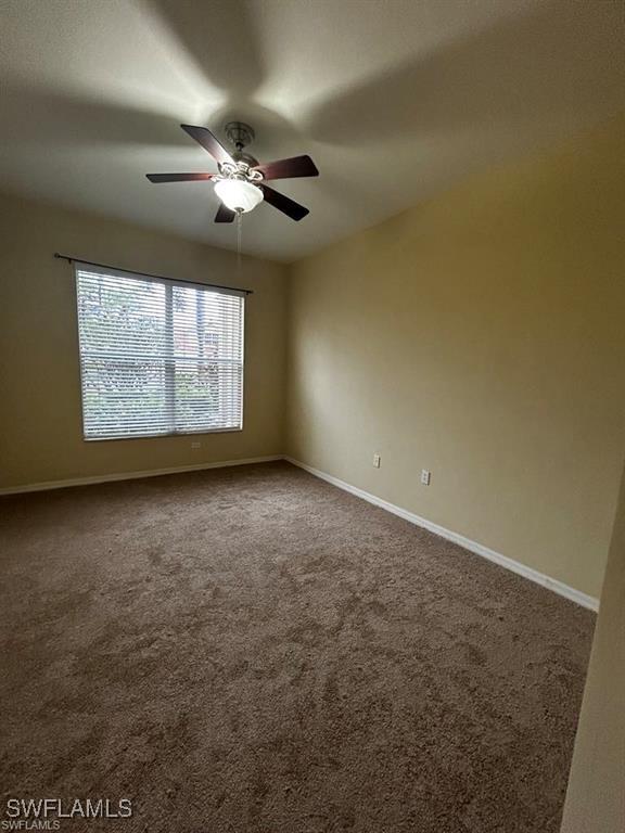 13000 Sandy Key Bnd Unit 3202, North Fort Myers, FL 33903 - carpeted empty room featuring a ceiling fan and baseboards