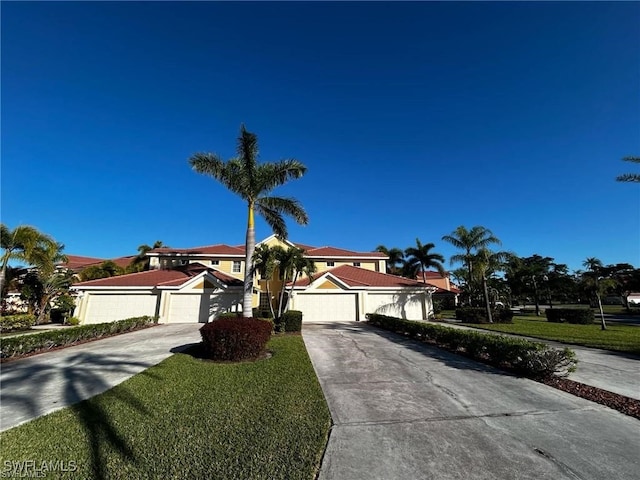 13000 Sandy Key Bnd Unit 3202, North Fort Myers, FL 33903 - view of front of property with concrete driveway and a front yard