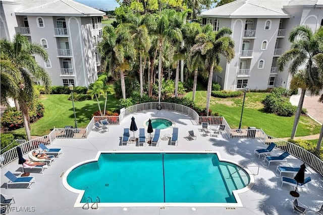 591 Audubon Blvd Unit B202, Naples, FL 34110 - community pool featuring a patio area