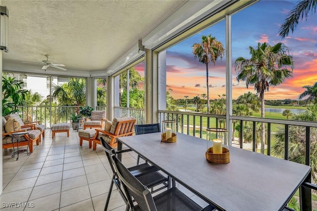 591 Audubon Blvd Unit B202, Naples, FL 34110 - sunroom with a water view, tile patterned flooring, and a textured ceiling