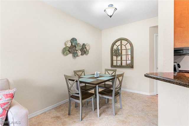 1373 Weeping Willow Ct, Cape Coral, FL 33909 - dining area with baseboards and light tile patterned floors