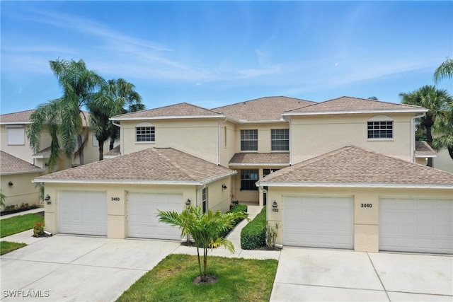 3460 W Crown Pointe Blvd Unit 101, Naples, FL 34112 - traditional-style house with stucco siding, a garage, a shingled roof, and driveway