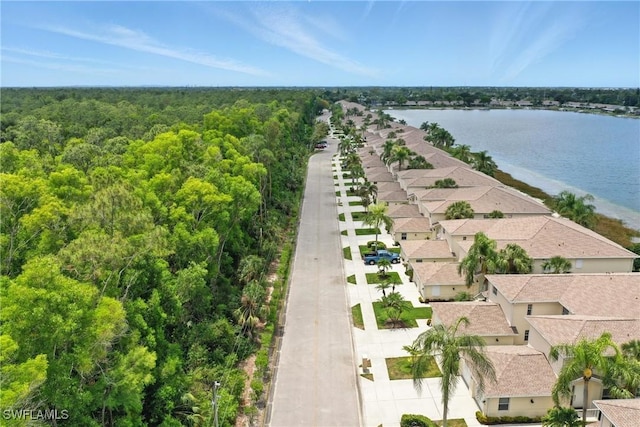 3460 W Crown Pointe Blvd Unit 101, Naples, FL 34112 - aerial view of residential area featuring a forest and a large body of water
