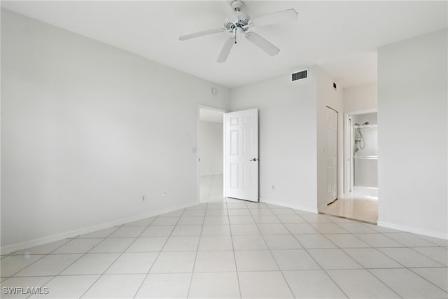 3460 W Crown Pointe Blvd Unit 101, Naples, FL 34112 - unfurnished bedroom with a ceiling fan, connected bathroom, and baseboards