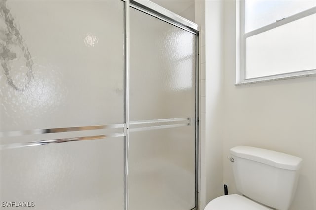 3460 W Crown Pointe Blvd Unit 101, Naples, FL 34112 - bathroom with a shower with shower door and toilet
