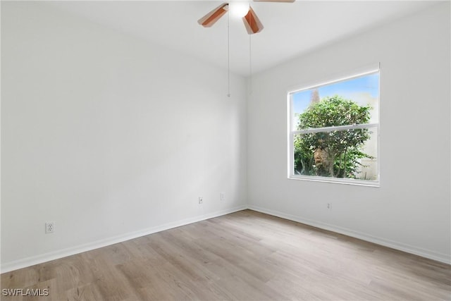 3460 W Crown Pointe Blvd Unit 101, Naples, FL 34112 - empty room featuring wood finished floors, a ceiling fan, and baseboards