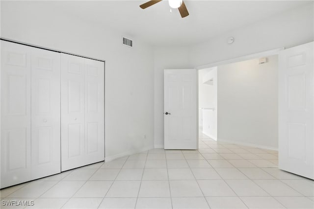 3460 W Crown Pointe Blvd Unit 101, Naples, FL 34112 - unfurnished bedroom with a closet, baseboards, and ceiling fan