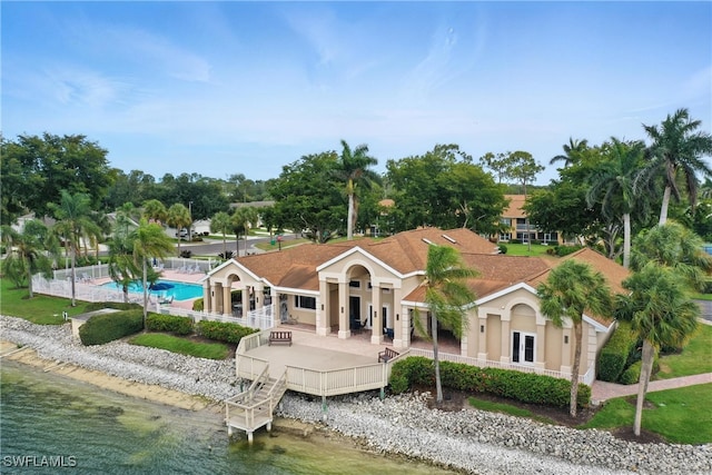 3460 W Crown Pointe Blvd Unit 101, Naples, FL 34112 - back of house with stucco siding and a water view