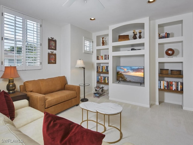 26986 Montego Pointe Ct Unit 202, Bonita Springs, FL 34134 - carpeted living room featuring built in shelves, ceiling fan, baseboards, and recessed lighting