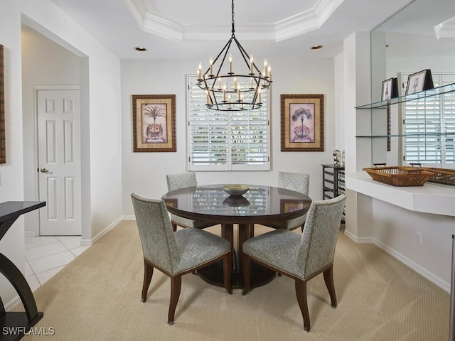 26986 Montego Pointe Ct Unit 202, Bonita Springs, FL 34134 - dining room with light colored carpet, a chandelier, crown molding, a tray ceiling, and baseboards