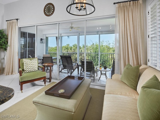 26986 Montego Pointe Ct Unit 202, Bonita Springs, FL 34134 - living room with tile patterned flooring, a ceiling fan, and a chandelier
