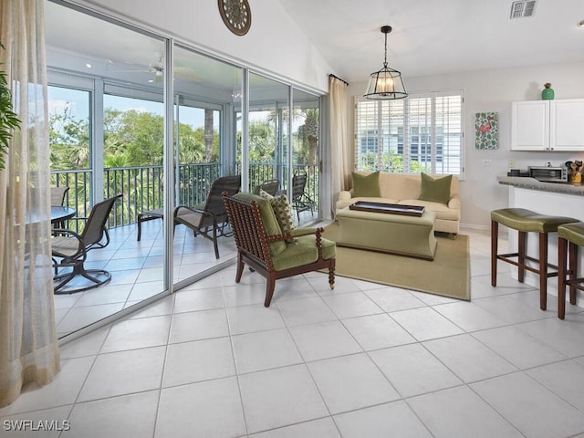 26986 Montego Pointe Ct Unit 202, Bonita Springs, FL 34134 - living room with baseboards and light tile patterned flooring