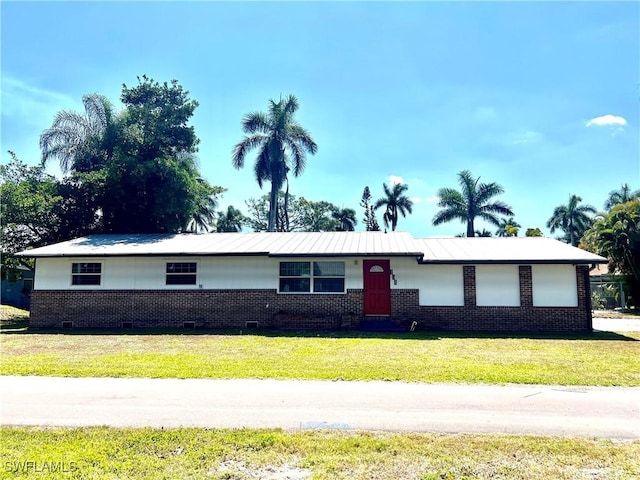 134 Standish Cir, North Fort Myers, FL 33903 - single story home with a front lawn, brick siding, and crawl space