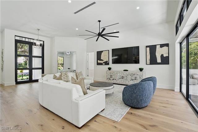 24721 Bay Bean Ct, Bonita Springs, FL 34134 - living area featuring recessed lighting, light wood-type flooring, baseboards, a towering ceiling, and a ceiling fan