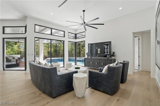 24721 Bay Bean Ct, Bonita Springs, FL 34134 - living area featuring ceiling fan, light wood finished floors, plenty of natural light, recessed lighting, and a high ceiling