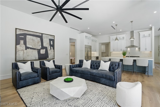 24721 Bay Bean Ct, Bonita Springs, FL 34134 - living area with light wood-style flooring, a ceiling fan, recessed lighting, and baseboards