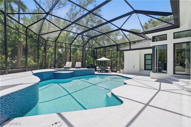 24721 Bay Bean Ct, Bonita Springs, FL 34134 - view of pool with a patio area, glass enclosure, and a pool with connected hot tub