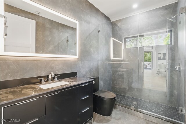 24721 Bay Bean Ct, Bonita Springs, FL 34134 - full bath featuring tile walls, a shower stall, vanity, and toilet