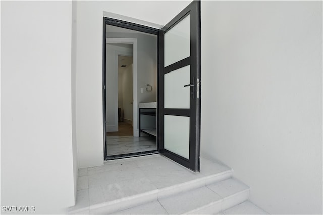 24721 Bay Bean Ct, Bonita Springs, FL 34134 - property entrance featuring stucco siding