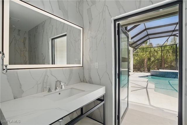 24721 Bay Bean Ct, Bonita Springs, FL 34134 - bathroom with a sink and tile walls