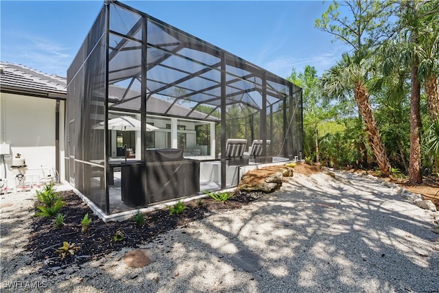 24721 Bay Bean Ct, Bonita Springs, FL 34134 - view of patio / terrace featuring glass enclosure