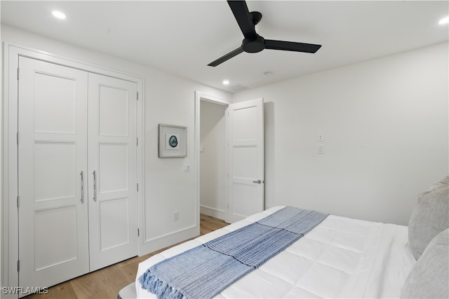 24721 Bay Bean Ct, Bonita Springs, FL 34134 - bedroom featuring light wood-style floors, recessed lighting, ceiling fan, and a closet