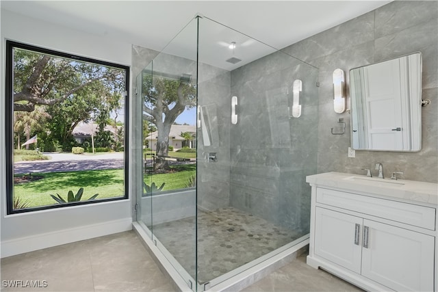 24721 Bay Bean Ct, Bonita Springs, FL 34134 - bathroom featuring a stall shower, vanity, and tile patterned floors