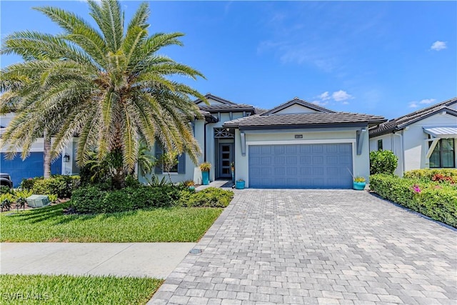 10138 Palazzo Dr, Naples, FL 34119 - single story home featuring decorative driveway, a garage, and stucco siding