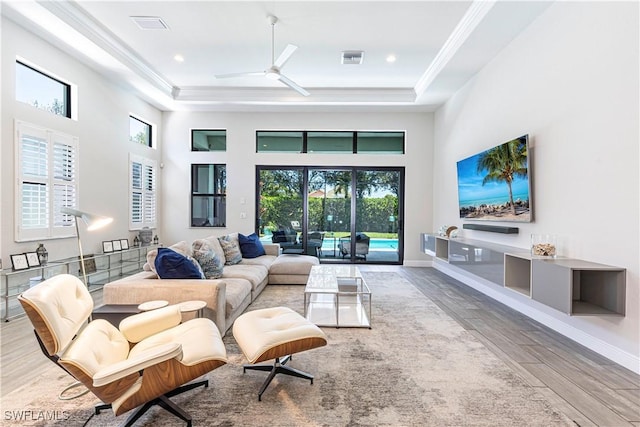 10138 Palazzo Dr, Naples, FL 34119 - living room with a high ceiling, wood finished floors, ceiling fan, ornamental molding, and recessed lighting