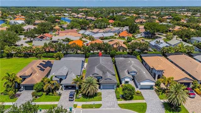10138 Palazzo Dr, Naples, FL 34119 - aerial perspective of suburban area featuring a large body of water