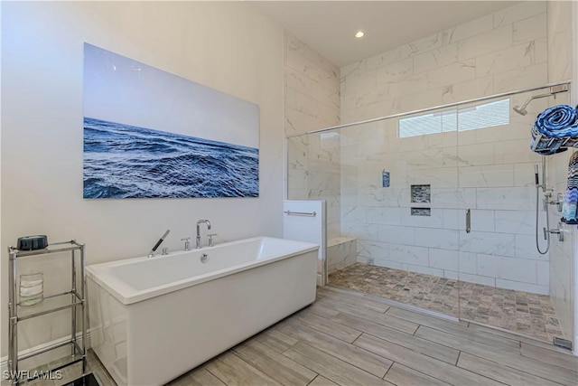 10138 Palazzo Dr, Naples, FL 34119 - bathroom with a freestanding tub, a shower stall, wood finish floors, and recessed lighting