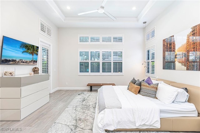 10138 Palazzo Dr, Naples, FL 34119 - bedroom with wood finished floors, a raised ceiling, crown molding, recessed lighting, and access to exterior