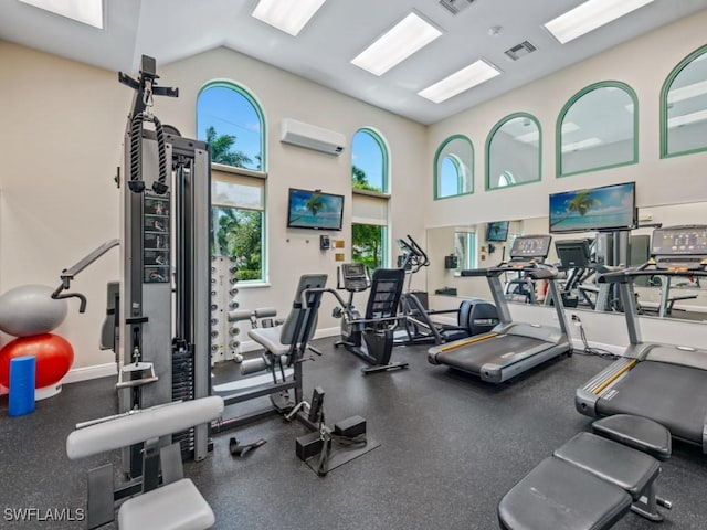 1079 Bald Eagle Dr Unit N604, Marco Island, FL 34145 - gym featuring a wall unit AC, healthy amount of natural light, and high vaulted ceiling