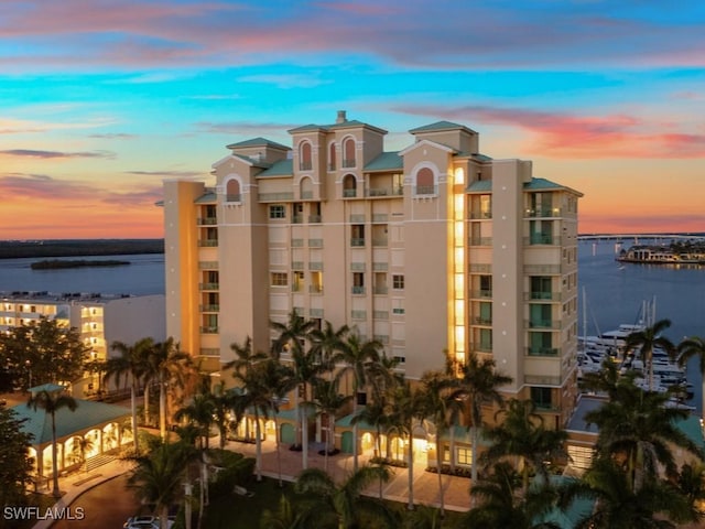 1079 Bald Eagle Dr Unit N604, Marco Island, FL 34145 - property at dusk featuring a water view