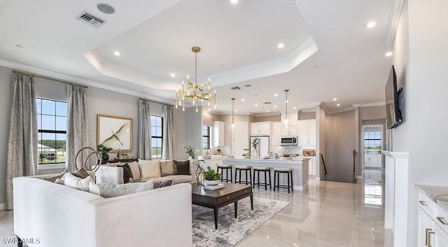 15315 Lucerna St Unit 201, Naples, FL 34114 - living area with ornamental molding, a raised ceiling, a chandelier, recessed lighting, and light marble finish flooring