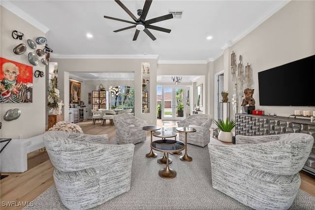 12501 Walden Run Dr, Fort Myers, FL 33913 - living area featuring wood finished floors, crown molding, a chandelier, a ceiling fan, and recessed lighting