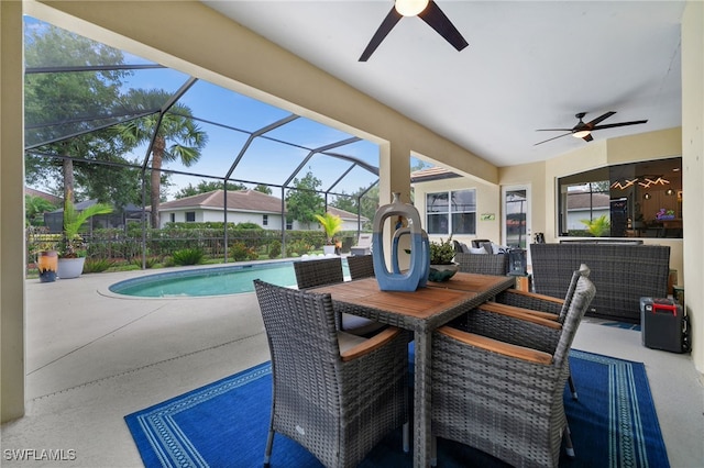 12501 Walden Run Dr, Fort Myers, FL 33913 - view of patio with a ceiling fan, an outdoor pool, glass enclosure, and outdoor dining area