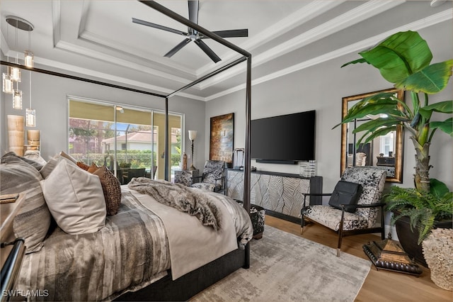 12501 Walden Run Dr, Fort Myers, FL 33913 - bedroom featuring wood finished floors, crown molding, access to outside, a tray ceiling, and a ceiling fan