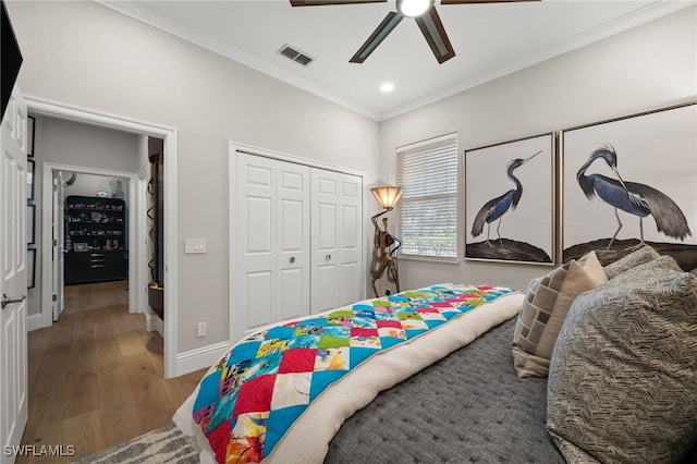 12501 Walden Run Dr, Fort Myers, FL 33913 - bedroom with wood finished floors, crown molding, a closet, baseboards, and ceiling fan