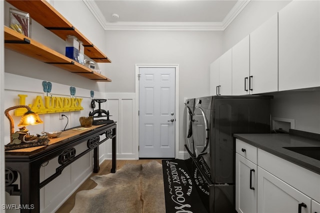 12501 Walden Run Dr, Fort Myers, FL 33913 - washroom with washing machine and dryer, ornamental molding, cabinet space, and dark wood-style flooring