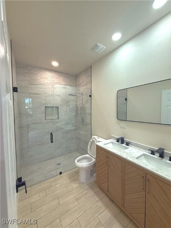 2917 50th St W, Lehigh Acres, FL 33971 - full bath featuring toilet, recessed lighting, double vanity, and a stall shower