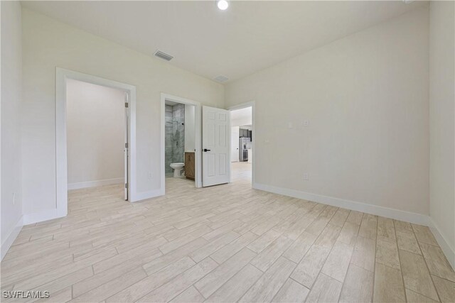 2917 50th St W, Lehigh Acres, FL 33971 - empty room with light wood-style flooring and baseboards