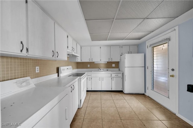 198 Joel Blvd Unit 5, Lehigh Acres, FL 33936 - kitchen featuring white appliances, washer / clothes dryer, under cabinet range hood, light countertops, and light tile patterned floors