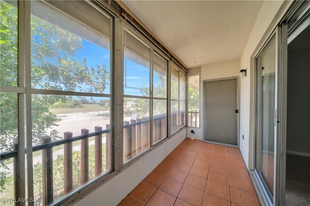 198 Joel Blvd Unit 5, Lehigh Acres, FL 33936 - unfurnished sunroom featuring tile patterned flooring